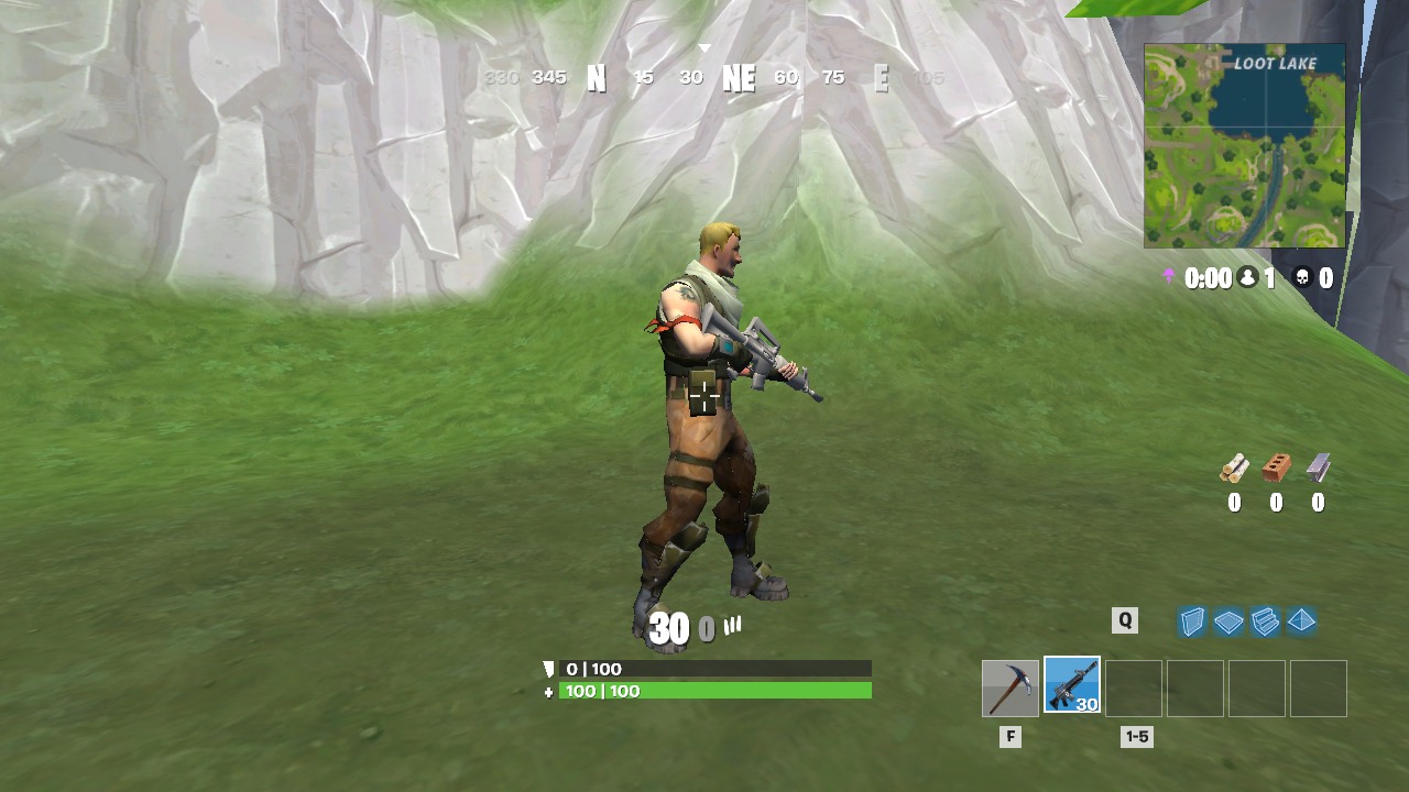 Player holding a rifle beneath the cliffs near Loot Lake.